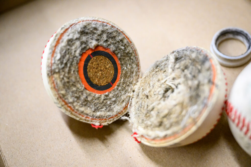 Baseball cut in half showing its core.