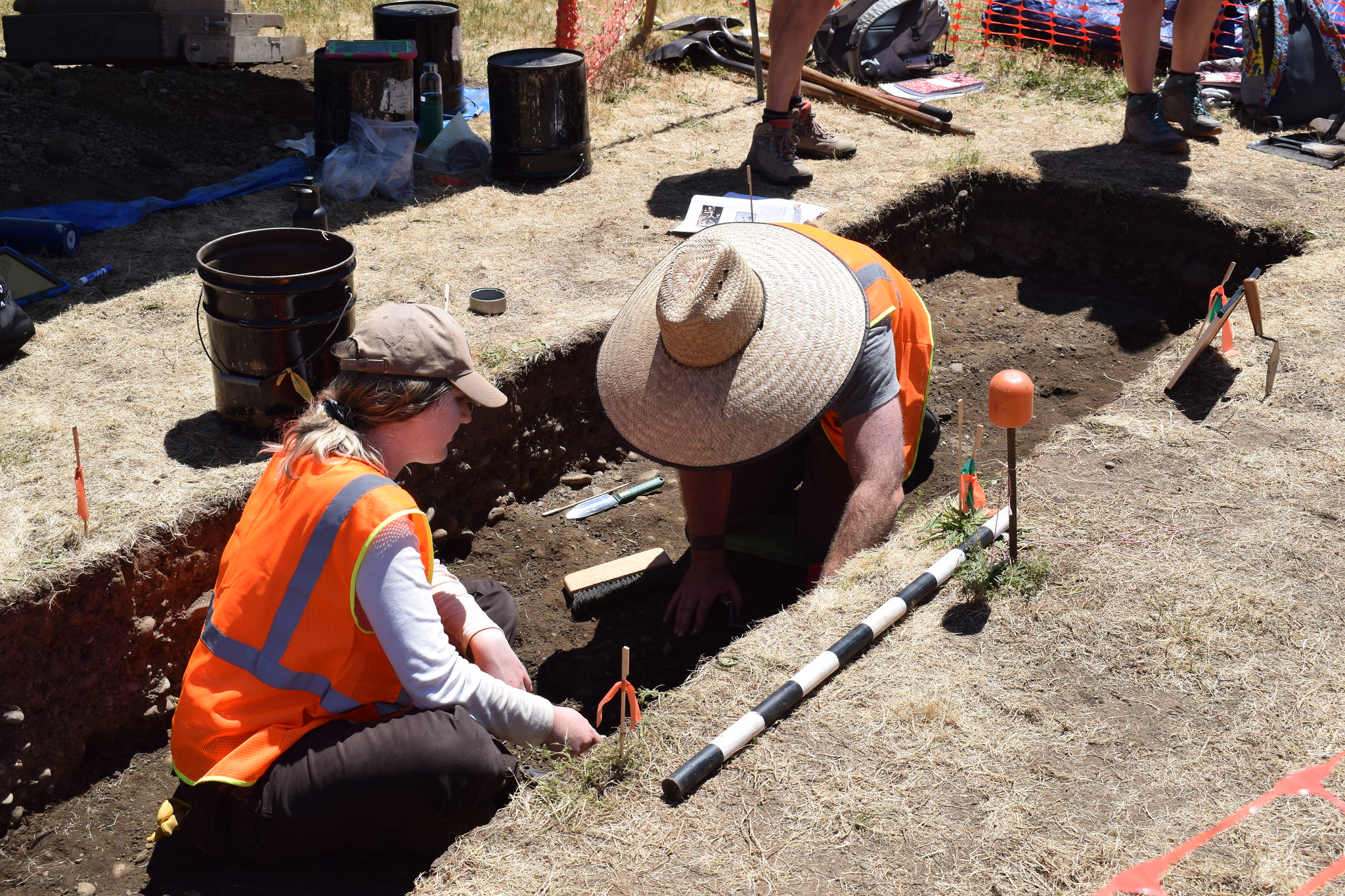 WSU Vancouver anthropology students conducting a field excavation wearing high-visibility vests