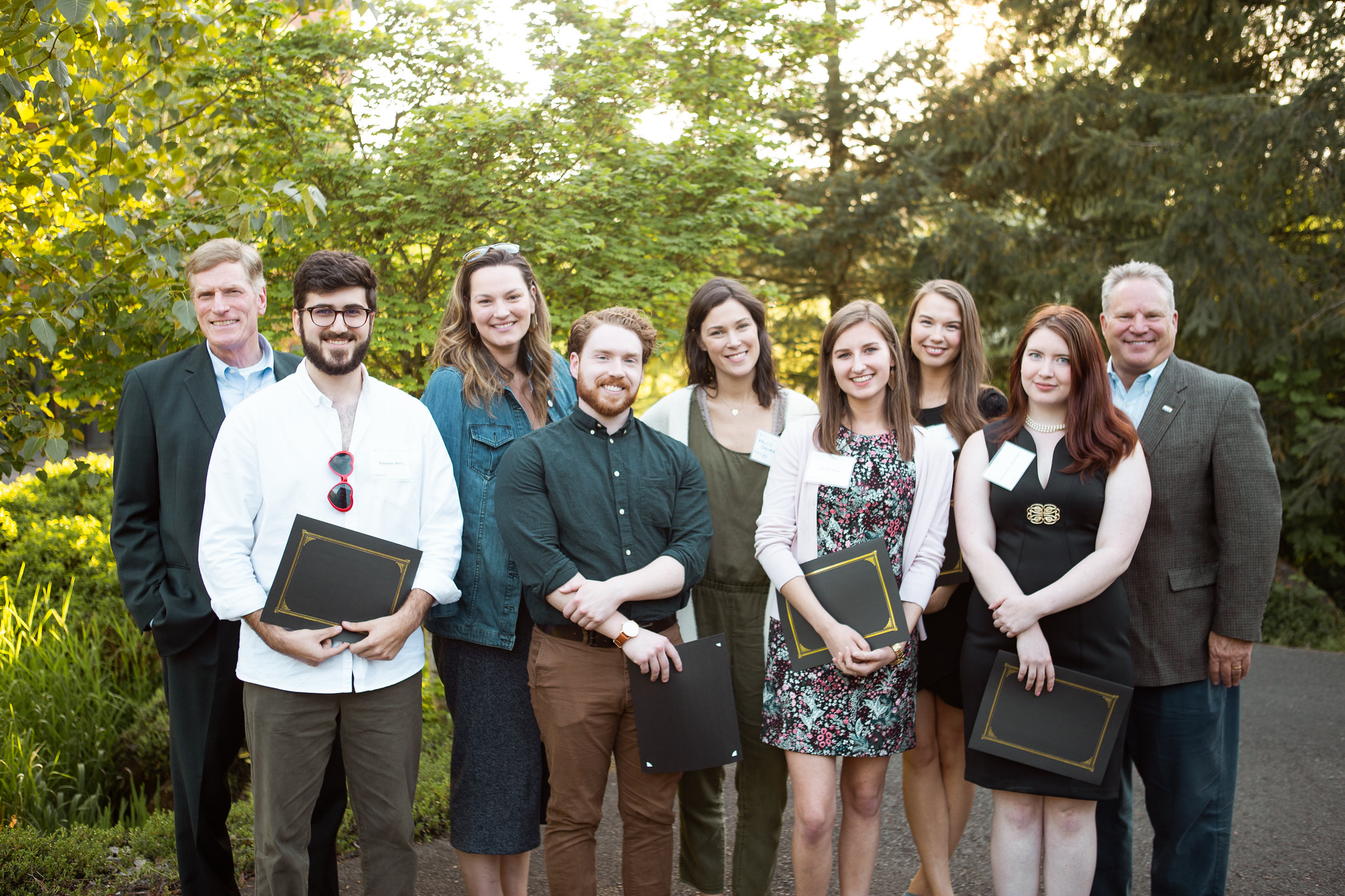 A group of professionally dressed individuals posing together for a WSU Vancouver team photo