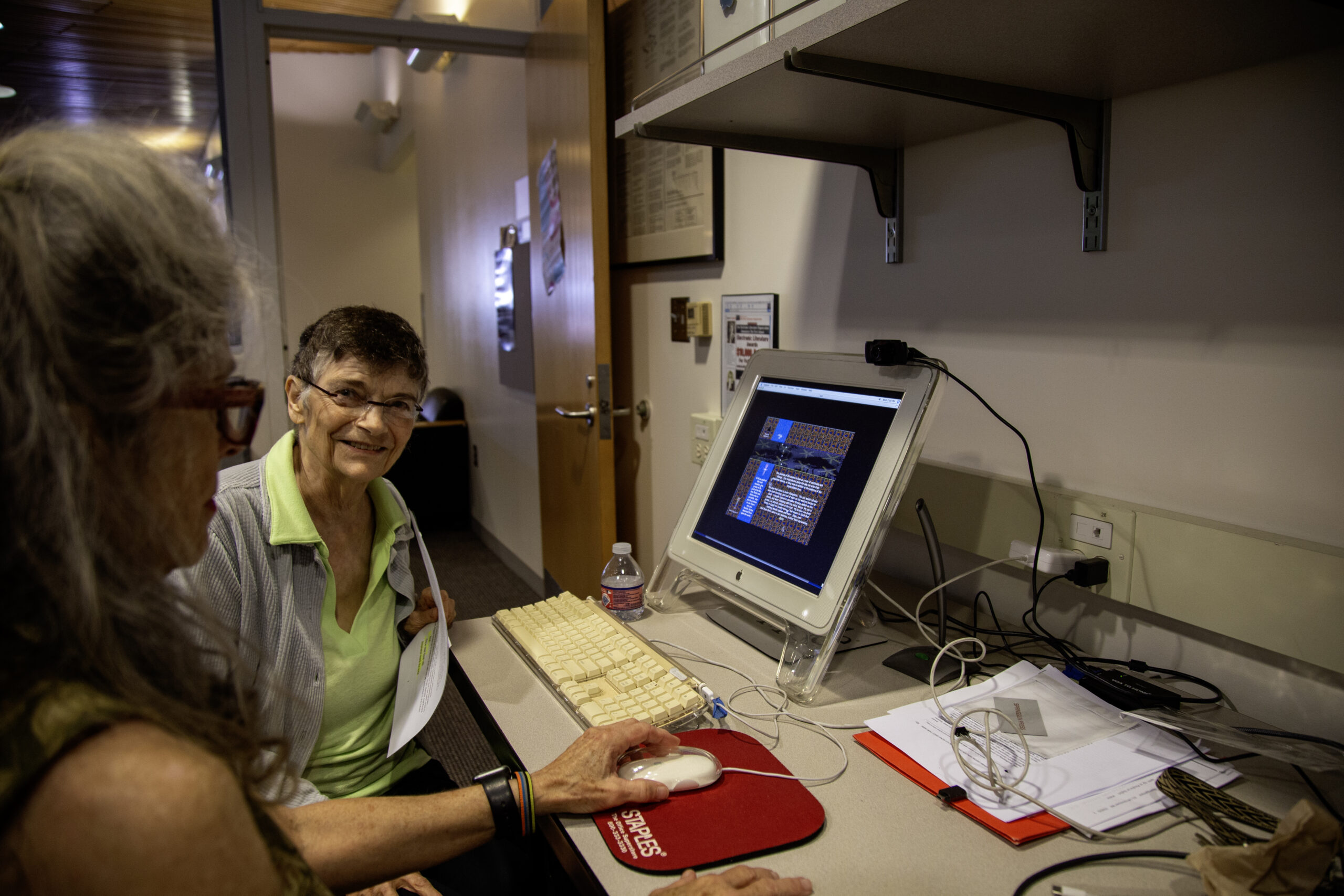 A staff member operating an industrial computer console system inside a WSU Vancouver laboratory