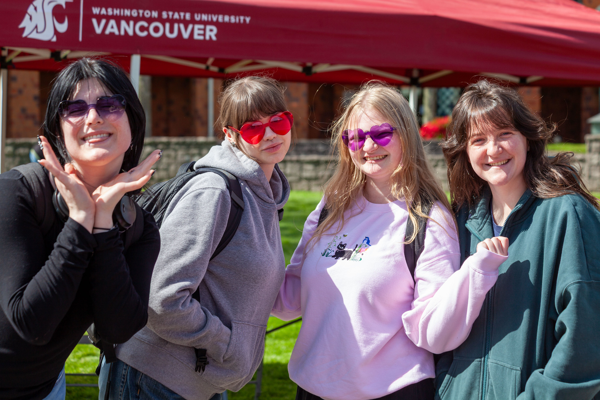 A group of friends posing together outdoors smiling