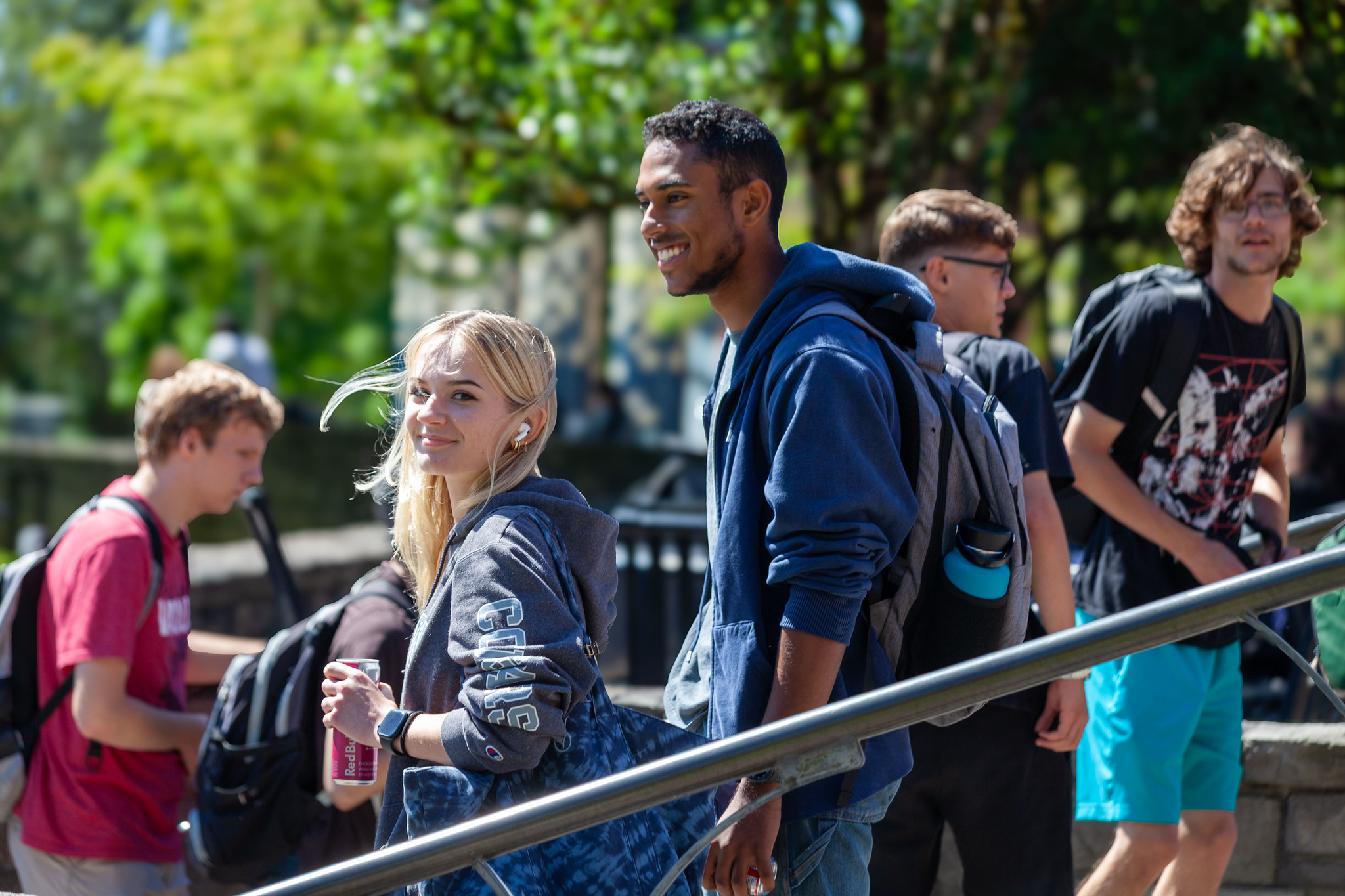 A group of children or students walking together in a line outside