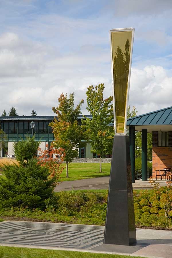 WSU Vancouver - Golden Section A modern campus building facade surrounded by lush green trees and landscaping