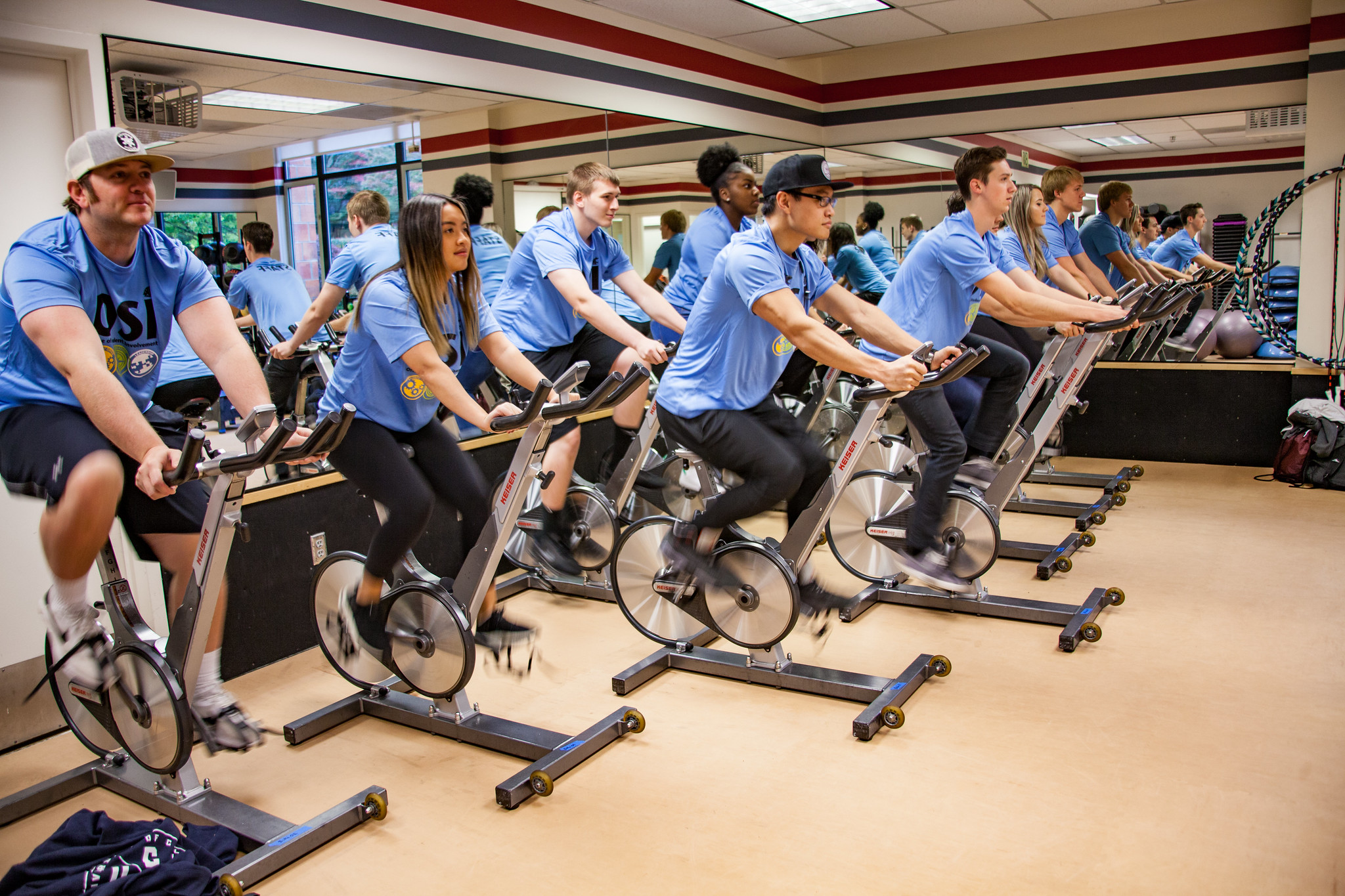 OSI Group exercise at WSU Vancouver Fitness Center | Students participating in an indoor group exercise or stationary cycling class on campus