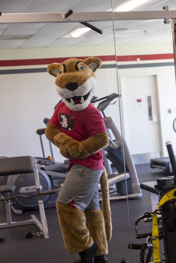 Flexing: Checking the gains in the mirror. Looking sharp and feeling even sharper at the WSU Vancouver fitness center.