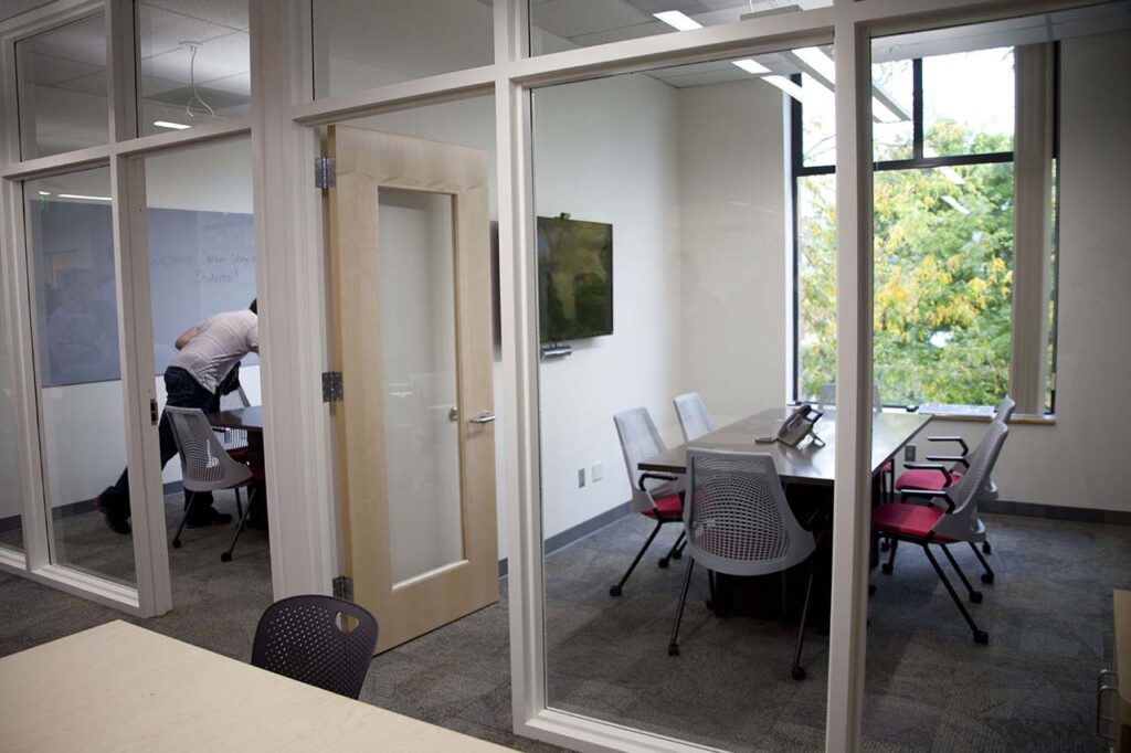 Study spaces - study-classroom-conference | An empty collaborative meeting room or glass-walled team study room inside a campus facility