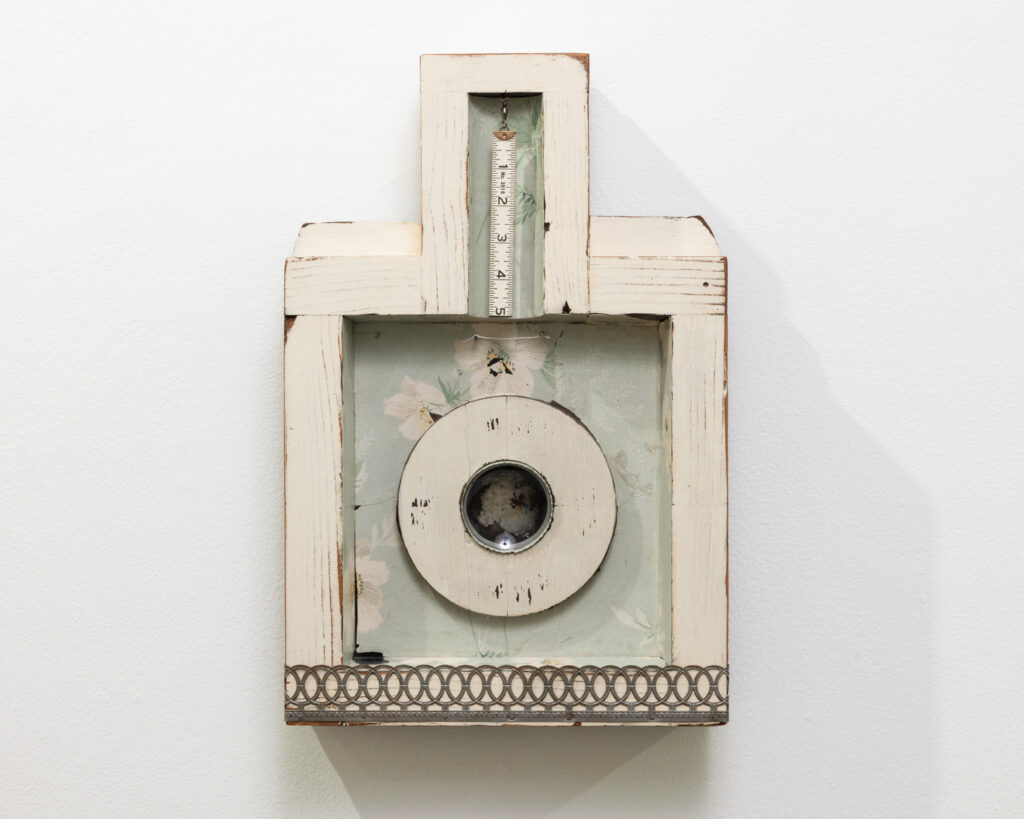 A vintage mechanical device showcased as part of a WSU Vancouver historical or art display