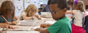 Young students participating in a hands-on learning activity at a WSU Vancouver community outreach event
