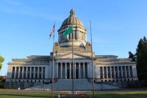 Exterior view of a majestic state capitol or grand campus building with a dome