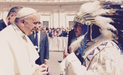 JoDe Goudy in a headdress meeting Pope Francis. 