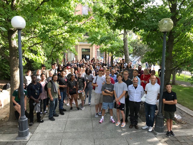 SDC students in a group photo at a BBQ in front of Carpenter Hall.