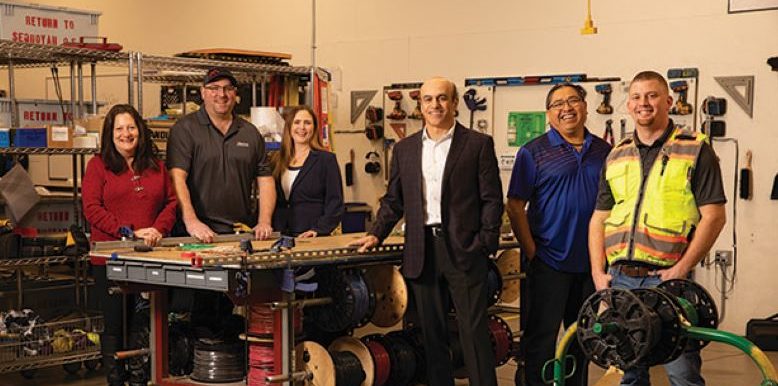 Sequoyah Electric President Mahmood Ghassemi, third from right — with, from left, Michele Amato, Tim Ostlie, Cheryl Nagel, Thurman Woods and Ryan Cruth.