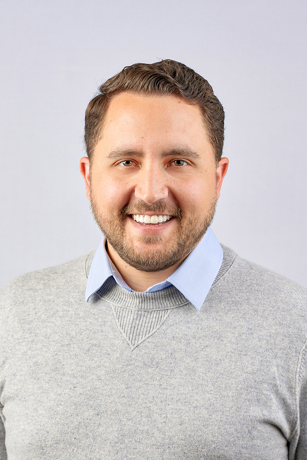 Headshot of Sam Holden.