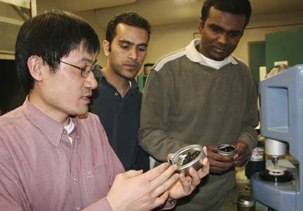 Haifang Wen and students work with environmentally-friendly bioasphalt