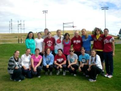 Students involved in the mentoring program for young engineering students pose behind the Student Recreation Center.