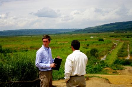 Two men looking out over a plain.