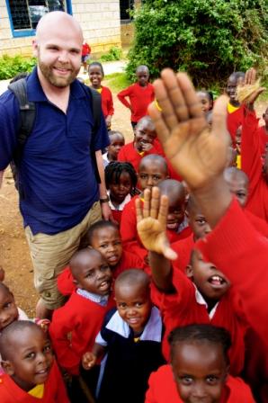 Children waving at the camera.