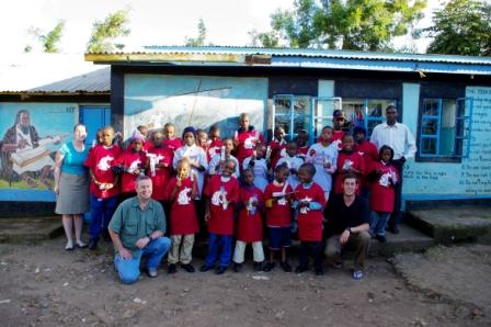 Group of children in front of a building.