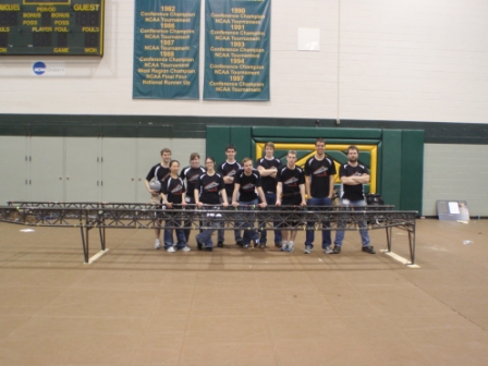 The Washington State University Steel Bridge team poses with bridge