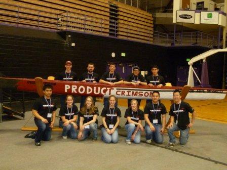 Washington State University's concrete canoe team pose with their canoe.