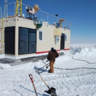 Professor Von P. Walden and his team moving the research station that is set up in Greenland to characterize atmosphere and clouds.