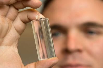 Ian Richardson holding a quartz crystal.