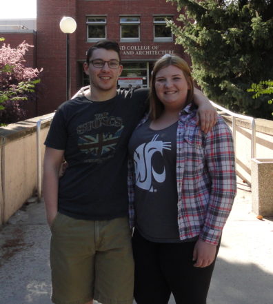 Amie and Ethan stand side-by-side with their arms draped across each other's shoulders.