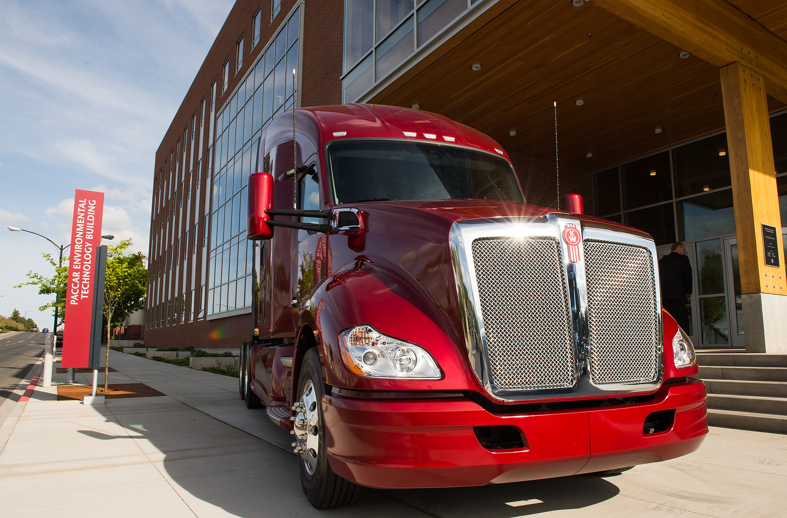 Red PACCAR Kenworth truck parked in front of the new PACCAR Environmental Technology Building.