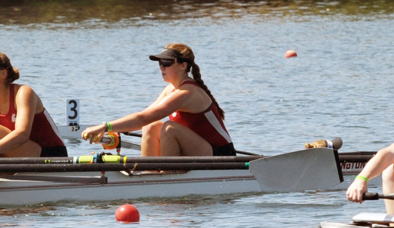 Paige Danielson sitting in the bow seat position in the WSU Varsity IV boat.