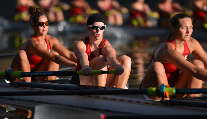 Jessica Howe rows a boat with her teammates.