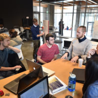 Professor Darrin Griechen works with students on solar decathlon design.