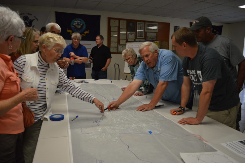 Students discuss the design of a lakeside trail system, parks and sidewalks for Electric City