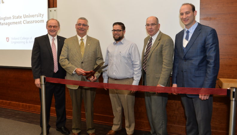 Ribbon cutting for Kiewit Construction Management Classroom, from left to right: Don Bender, interim dean of Voiland College; Scott Cassels, executive vice president of Kiewit Corporation; Jason Peschel, program head, construction management; Max Kirk, associate professor, construction management; and Phil Gruen, director, SDC