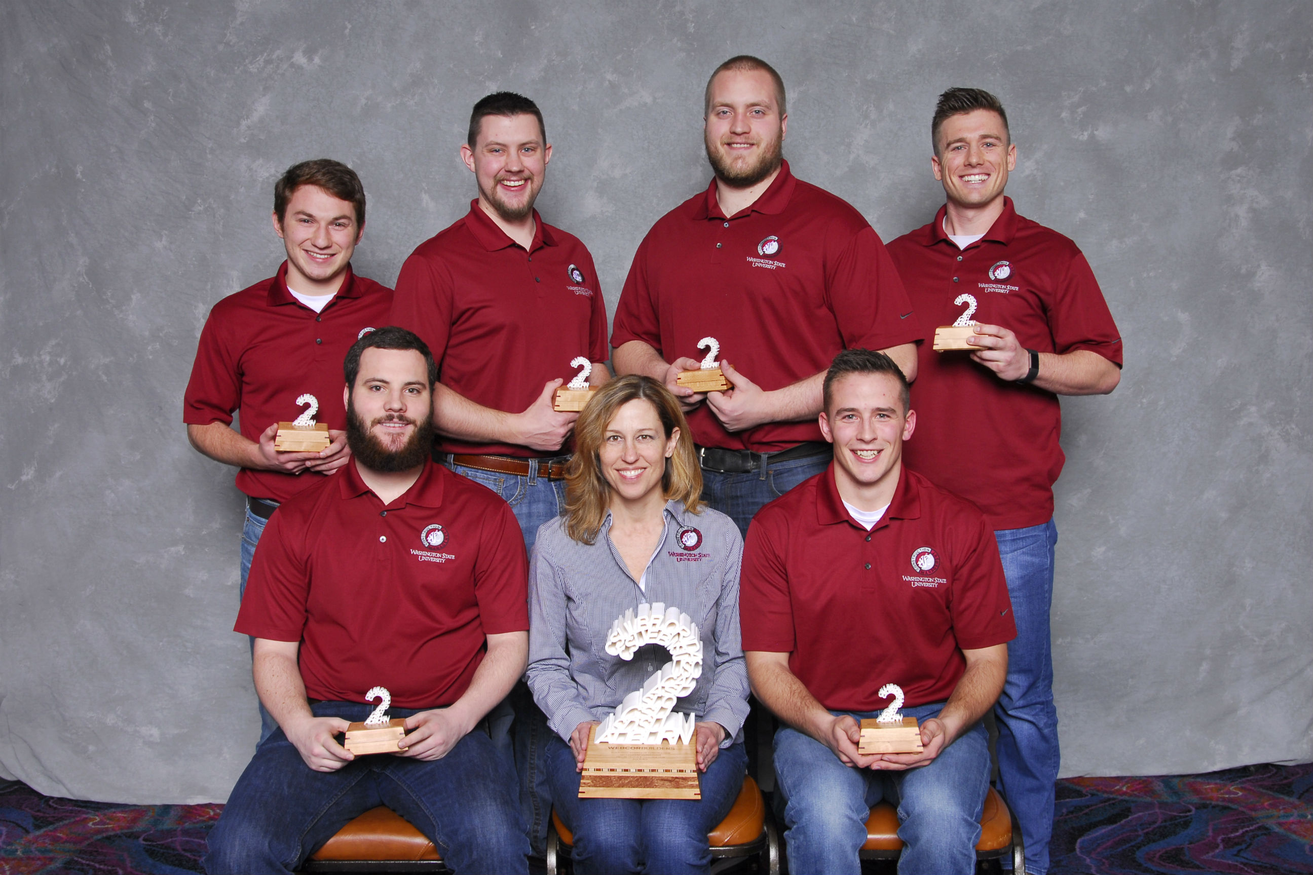 Second-place winning team in the virtual design and construction category group photo with their trophies