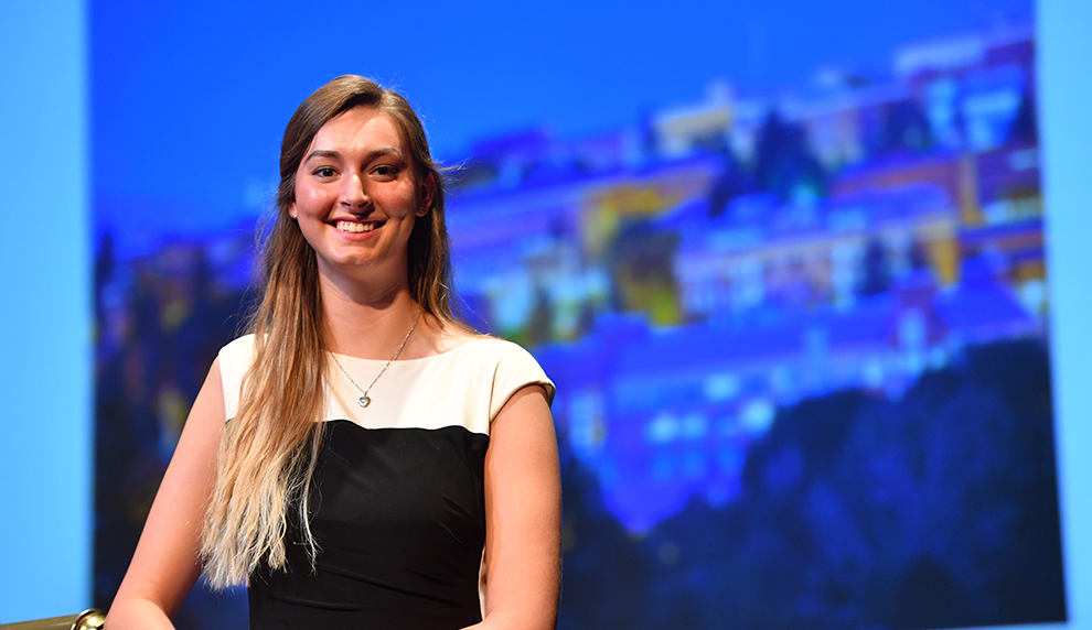 Alyssa Norris wearing a black and white dress.