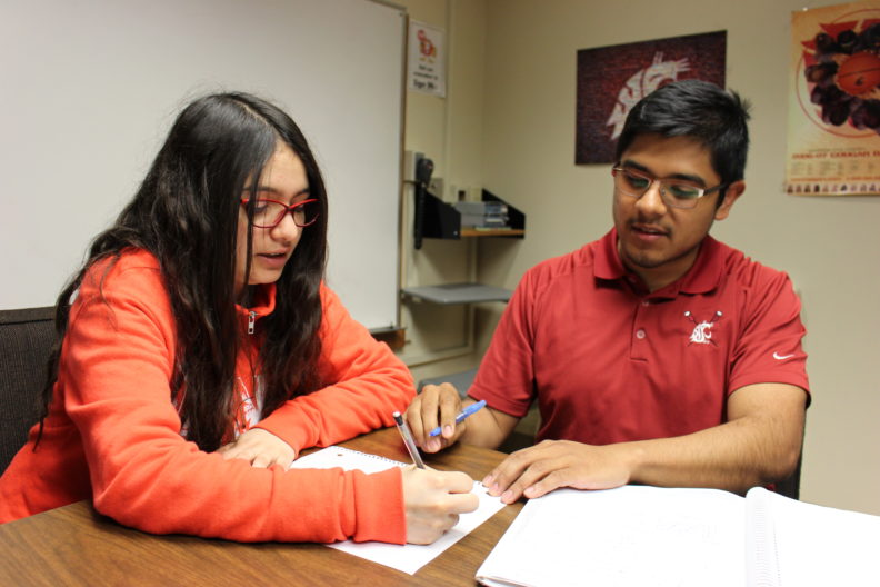 Ramiro Gonzalez and another student sitting at a table.