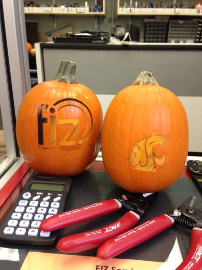 Two pumpkins engraved with the Frank Innovation logo and WSU logo.