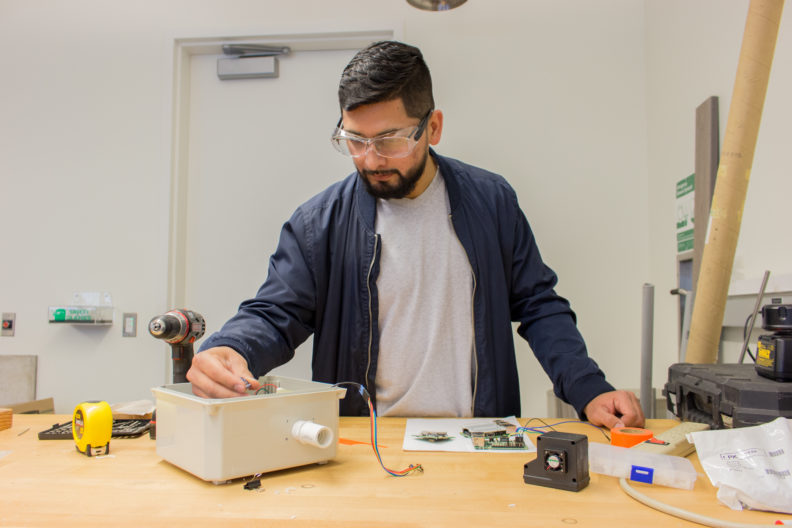 Rodriguez works with sensors in the lab.