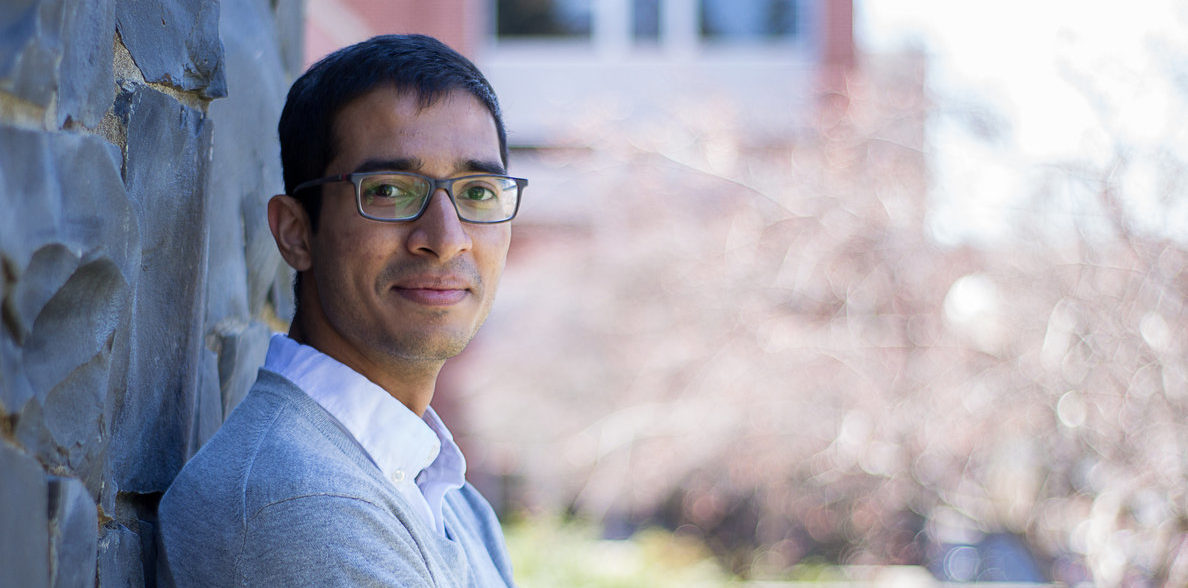 Parth Chandak leaning against a wall on the WSU campus.