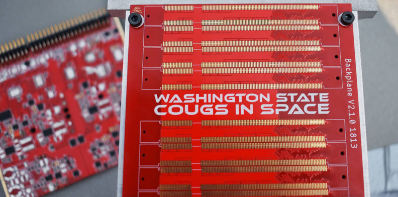 Closeup of electrical circuit board with the text Washington State Cougs in Space.