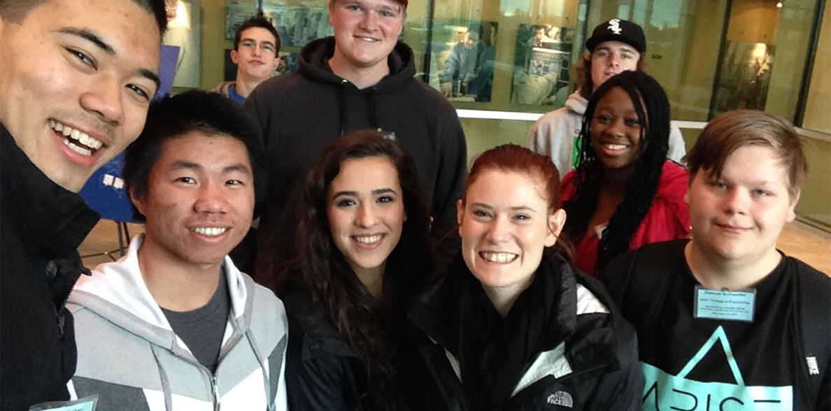 WSU STARS Director Katy Tetrick poses with eight students.