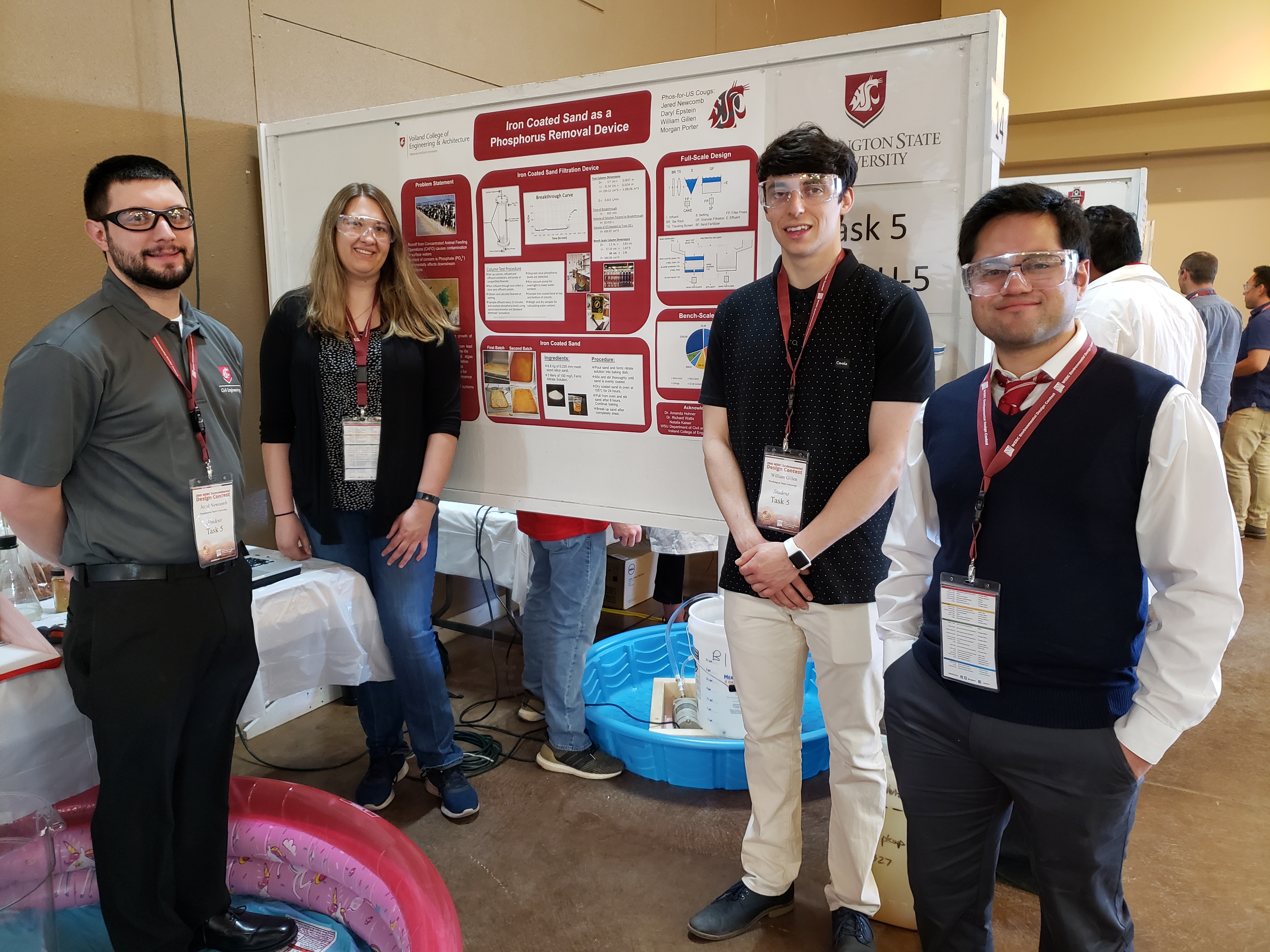 WSU team poses next to a poster titled Iron Coated Sand as a Phosphorus Removal Device.
