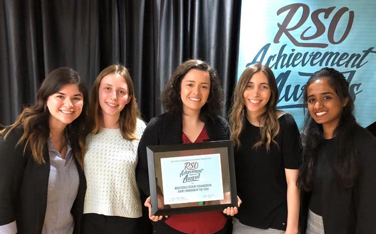 Officers of the Society for Women Engineers pose with their Event of the Year award.