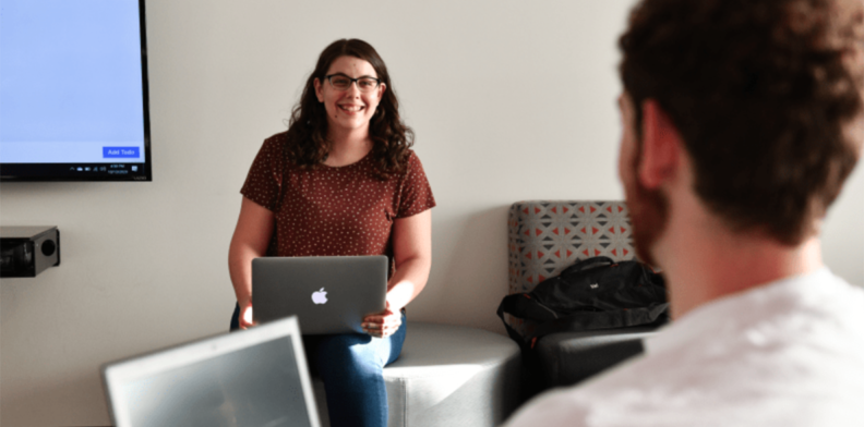 WSU Tri-Cities computer science student KJ Galvan chats with a fellow student.