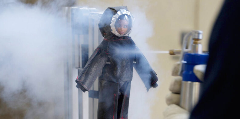 A doll gets cleaned with liquid nitrogen spray.