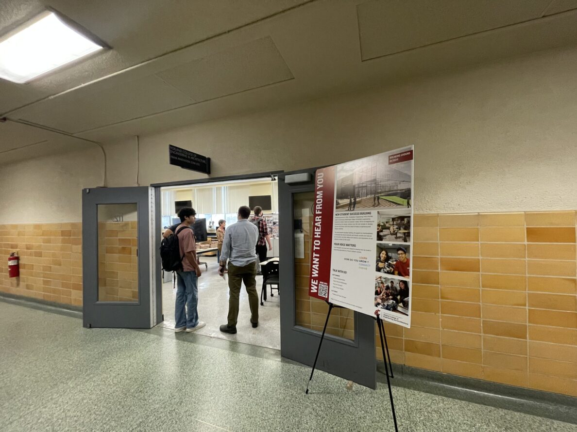Room entrance with a sign that reads we want to hear from you.