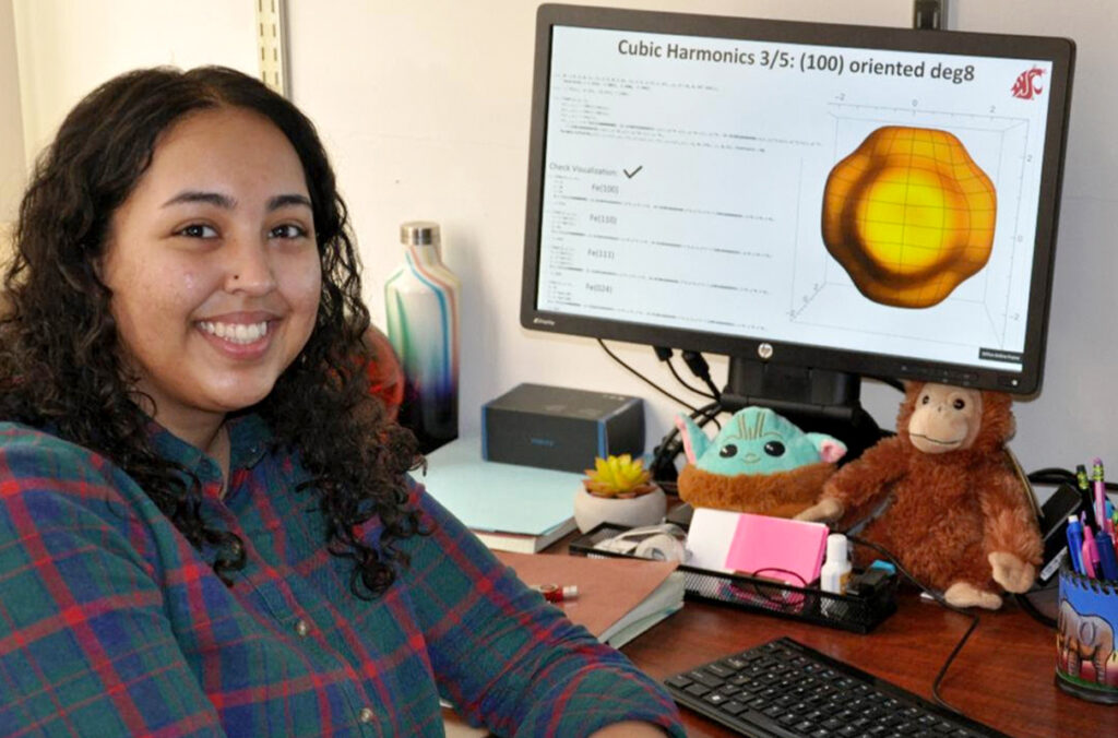 Naseeha Cardwell sitting at her desk.