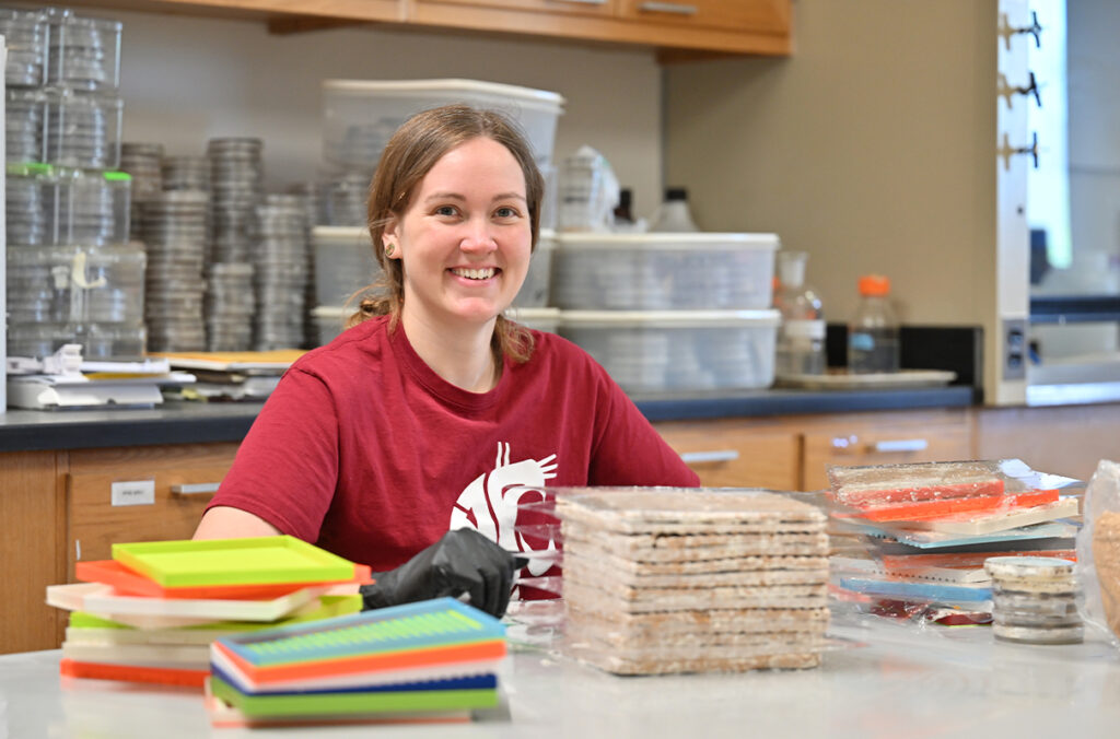 Katy Ayers working in a lab.