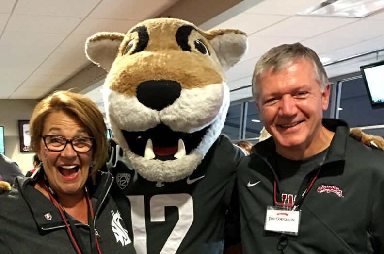 Jim and Diane Coughlin pose for a photo with Butch T. Cougar.