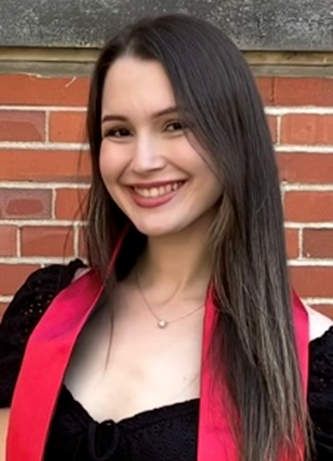 student smiling at the camera.